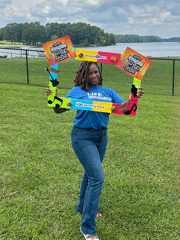 Community Involvement - Team Member Portrait Outdoors with Fun Frame